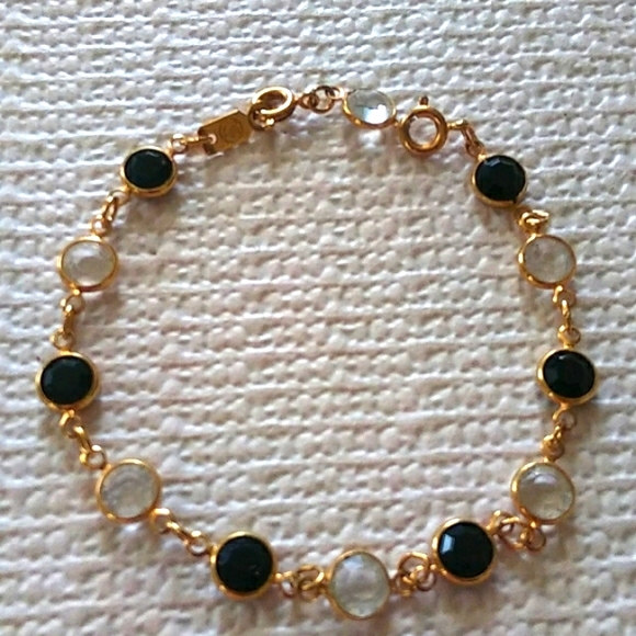 Swarovski Jewelry - SWAROVSKI GOLDTONE BLACK AND CLEAR CRYSTAL BEZEL BRACELET.